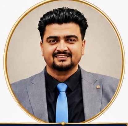 Portrait of CEO Ejaz Mehmood Khadim Choudhry in a grey suit and blue tie