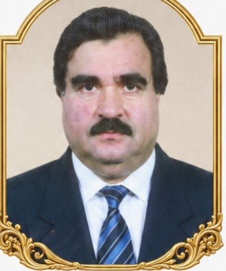 Late Mr. Choudhry Khadim Hussain, founder, in a suit and striped tie